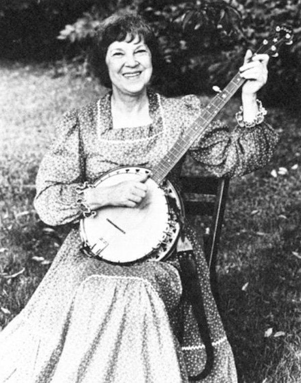 A woman playing the banjo.