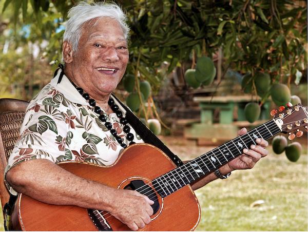 A man playing a guitar.