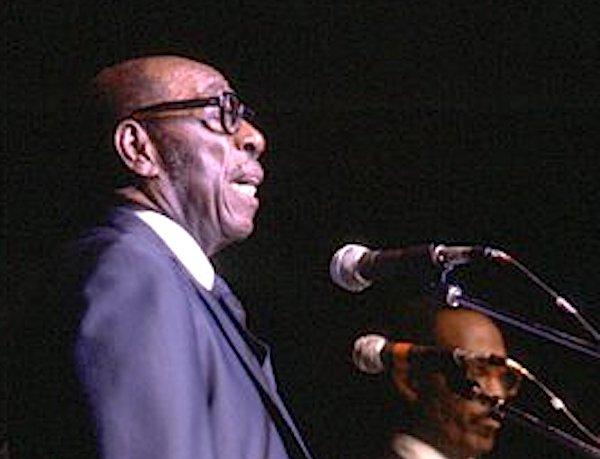 Man singing into a microphone.