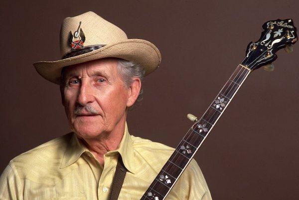 A man holding a guitar.
