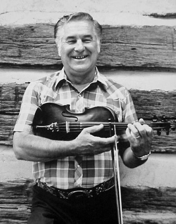 Man holding a fiddle.
