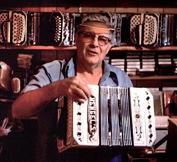 Man holding an accordion.