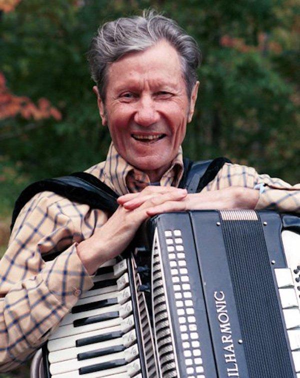 A man holding an accordion.