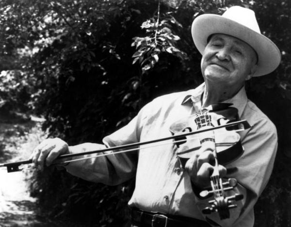Man playing a fiddle.