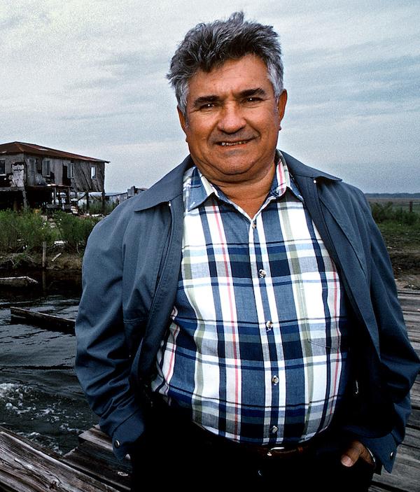 A man standing near a dock.
