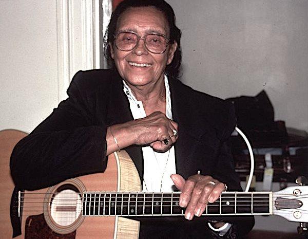 A man holding a guitar