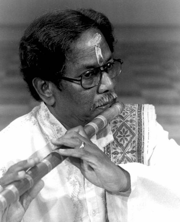 Man playing the flute.