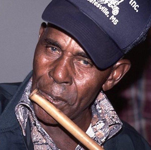 Man playing a flute.