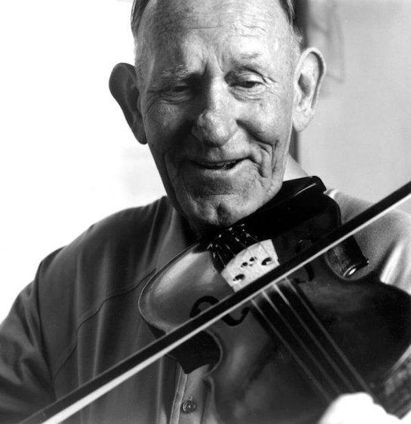 A man playing the fiddle.