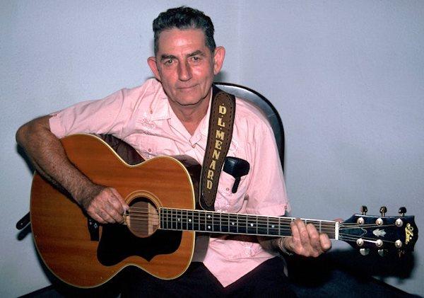 A man playing a guitar.