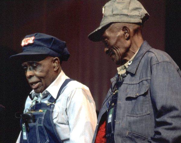 Two men on a stage.
