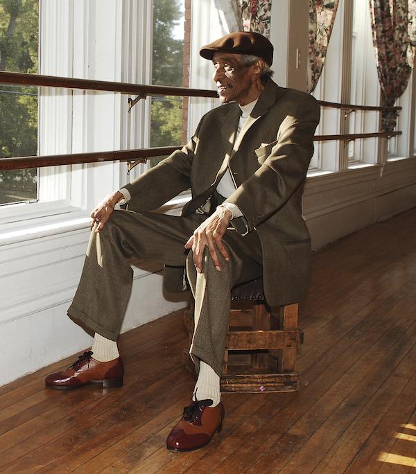 A man sitting by a window.
