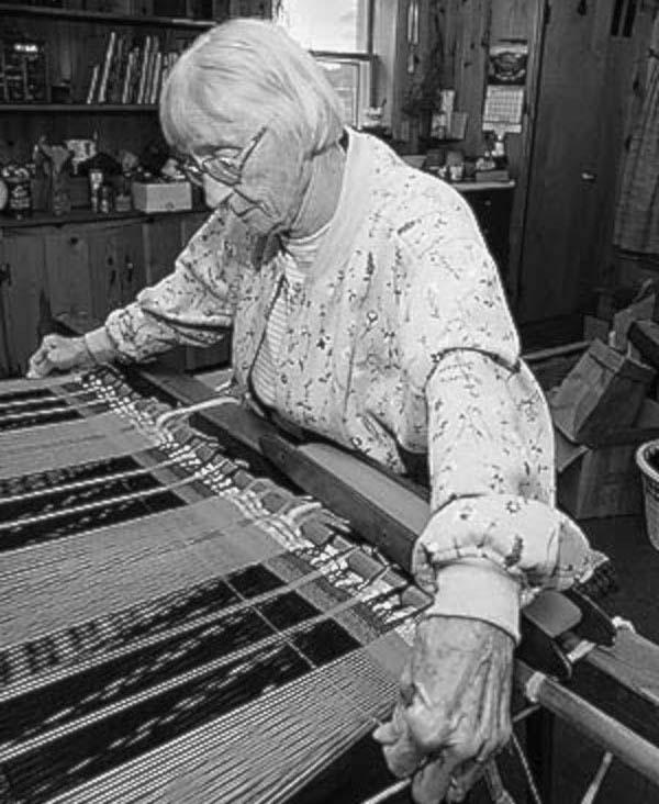 A woman with loom.