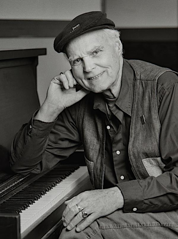 A man sitting at a piano.