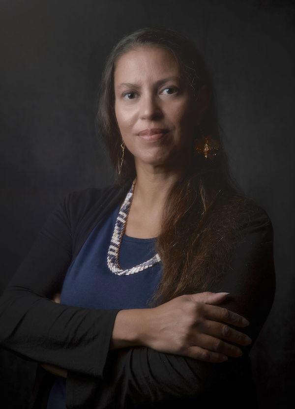 A woman poses for the camera.