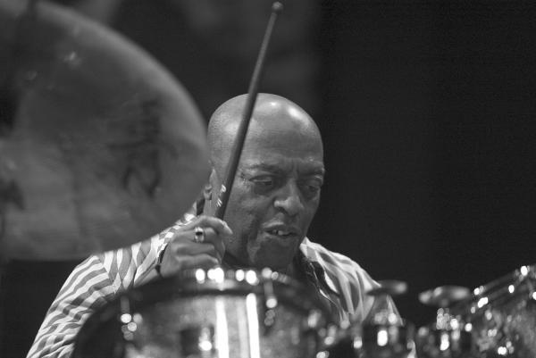 Man playing drums. 