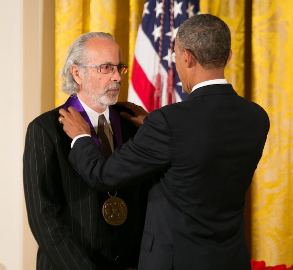 Alpert receiving medal.