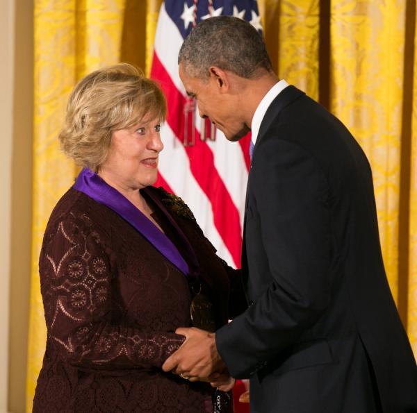 Arison receiving her medal.