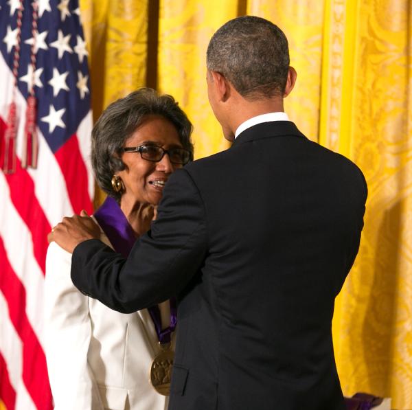 Brown receiving her medal form President Obama.
