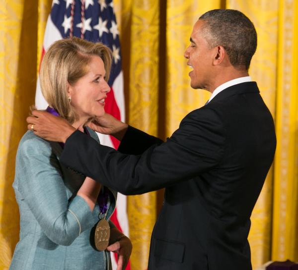 Fleming receiving her medal form President Obama.