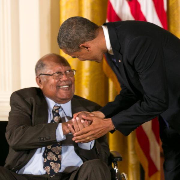 Gaines receiving his medal form President Obama.