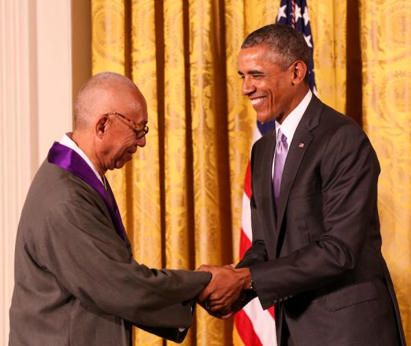 Ping Chong receives his medal from President Obama