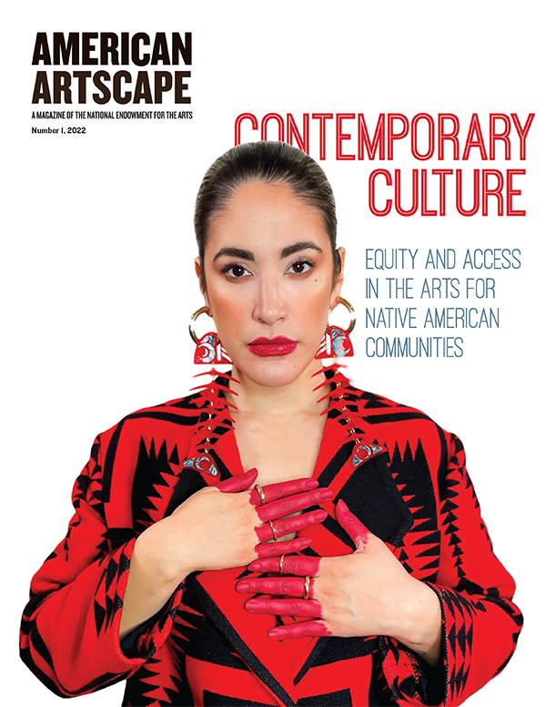 Cover of American Artscape magazine with a photo of a Native American woman in a red and black outfit and her hands painted red. 